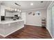 Kitchen with island, stainless appliances and hardwood floors, adjacent to dining area at 2436 Stingray Blvd, North Charleston, SC 29406