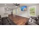Bright living room with hardwood floors, large windows, and sliding glass door bringing the outside in at 2436 Stingray Blvd, North Charleston, SC 29406