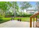 Private backyard with patio, green lawn, and mature trees at 2520 Woodstream Rd, Mount Pleasant, SC 29466