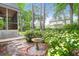 A peaceful backyard garden with a bird bath and flowering shrubs at 2520 Woodstream Rd, Mount Pleasant, SC 29466