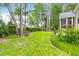 This home features a spacious yard with beautiful mature trees at 2520 Woodstream Rd, Mount Pleasant, SC 29466