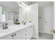 This bathroom boasts double sinks, a large mirror, and modern fixtures at 2520 Woodstream Rd, Mount Pleasant, SC 29466
