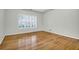 This bedroom has gleaming hardwood floors and a large window at 2520 Woodstream Rd, Mount Pleasant, SC 29466
