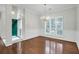 Formal dining room showcasing hardwood floors, a chandelier, and wainscoting at 2520 Woodstream Rd, Mount Pleasant, SC 29466