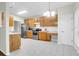 Open-concept kitchen with stainless steel appliances, wood cabinets and tile flooring at 2520 Woodstream Rd, Mount Pleasant, SC 29466
