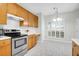 Bright kitchen showcasing stainless steel appliances and ample natural light at 2520 Woodstream Rd, Mount Pleasant, SC 29466