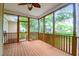 Enjoy a relaxing time in this screened porch with wood flooring and ceiling fan at 2520 Woodstream Rd, Mount Pleasant, SC 29466