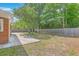 Backyard featuring wood fence, green trees, and a concrete patio at 2534 Flamingo Dr, Charleston, SC 29414