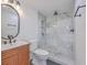 Modern bathroom featuring marble tile shower, wood vanity, and stylish fixtures at 2534 Flamingo Dr, Charleston, SC 29414