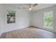 Cozy bedroom featuring hardwood floors and plenty of natural light from large windows at 2534 Flamingo Dr, Charleston, SC 29414