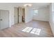 Bright bedroom featuring wood floors, white walls, natural light from a window, and closet at 2534 Flamingo Dr, Charleston, SC 29414