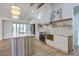 Modern kitchen featuring a large island, stainless steel appliances, open shelves and white cabinets at 2534 Flamingo Dr, Charleston, SC 29414