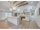 Bright and modern kitchen featuring a large center island, stainless steel appliances, and custom cabinetry at 2534 Flamingo Dr, Charleston, SC 29414