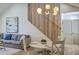 Stylish living and dining area with a modern staircase, vaulted ceilings, and designer lighting at 2534 Flamingo Dr, Charleston, SC 29414