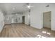 Open living room with wood floors, white walls, multiple ceiling fans, and French doors at 2534 Flamingo Dr, Charleston, SC 29414