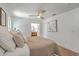 Bright main bedroom featuring wood floors, natural light, and ensuite bathroom at 2534 Flamingo Dr, Charleston, SC 29414