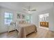 Bright main bedroom featuring wood floors, natural light, and ensuite bathroom at 2534 Flamingo Dr, Charleston, SC 29414