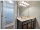 Bathroom with a double sink vanity, a large mirror with vanity lighting, and a separate shower and toilet room at 2627 Rutherford Way, Charleston, SC 29414