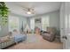 Bright bedroom featuring a cozy reading chair, a tent, and bright natural light at 2627 Rutherford Way, Charleston, SC 29414