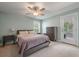 Comfortable bedroom with a cozy bed, view of the backyard, and a chest of drawers at 2627 Rutherford Way, Charleston, SC 29414