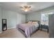 Light-filled bedroom with a ceiling fan, plush carpet, and neutral walls offers a calm and relaxing atmosphere at 2627 Rutherford Way, Charleston, SC 29414