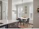 Bright dining area featuring a round table, four chairs, and natural light from shuttered windows at 2627 Rutherford Way, Charleston, SC 29414