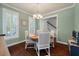 Cozy dining area with a round table, surrounded by elegant chairs and bathed in natural light at 2627 Rutherford Way, Charleston, SC 29414