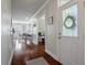 Inviting entryway with hardwood floors, leading to a dining area and other living spaces in the home at 2627 Rutherford Way, Charleston, SC 29414