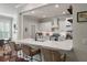 Bright, updated kitchen featuring white cabinets, stainless steel appliances, and breakfast bar seating at 2627 Rutherford Way, Charleston, SC 29414