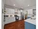 Spacious kitchen featuring white cabinets, stainless steel appliances, and stylish countertop decor at 2627 Rutherford Way, Charleston, SC 29414
