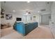 Bright living room with a plush blue sectional sofa, a TV, and bright, natural light through the window at 2627 Rutherford Way, Charleston, SC 29414
