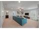 Spacious living room with plush blue sectional sofa, ceiling fan, and a media center with large-screen TV at 2627 Rutherford Way, Charleston, SC 29414