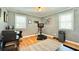 Bright bedroom featuring wood floors, a workout area, and ample natural light from two windows at 2636 Elissa Dr, Charleston, SC 29414