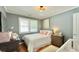 Well-lit Bedroom with wood floors, neutral paint, and crib at 2636 Elissa Dr, Charleston, SC 29414