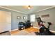 Bedroom featuring wood floors, a workout area, a desk, and natural light from a window at 2636 Elissa Dr, Charleston, SC 29414