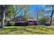 Brick home with well-kept lawn and blooming azaleas enhancing the curb appeal, inviting and picturesque at 2636 Elissa Dr, Charleston, SC 29414