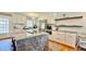 Modern kitchen featuring white cabinetry, granite countertops, stainless steel appliances, and a central island at 2636 Elissa Dr, Charleston, SC 29414