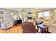 Inviting living room features hardwood floors, a ceiling fan, and lots of natural light from the large window at 2636 Elissa Dr, Charleston, SC 29414