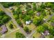Aerial view showcasing the property's large lot surrounded by mature trees and neighborhood streets at 285 Roosevelt Dr, Saint Stephen, SC 29479