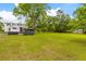 Expansive backyard featuring lush greenery and mature trees, offering ample space for recreation and relaxation at 285 Roosevelt Dr, Saint Stephen, SC 29479