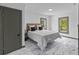 Well-lit bedroom with gray marble floors, light neutral wall paint, and modern lighting at 285 Roosevelt Dr, Saint Stephen, SC 29479