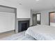 Spacious bedroom with a classic fireplace, closet, and door to other rooms at 285 Roosevelt Dr, Saint Stephen, SC 29479