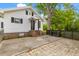 Charming white house with brick foundation, black shutters, and well-maintained lawn at 285 Roosevelt Dr, Saint Stephen, SC 29479
