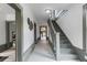 Inviting hallway with staircase, white walls, and decorative accents leading to other rooms at 285 Roosevelt Dr, Saint Stephen, SC 29479