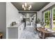 Charming kitchen featuring white cabinetry, stone countertops, and a dining nook at 285 Roosevelt Dr, Saint Stephen, SC 29479