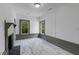 Living room with white and gray trim, white marble-look flooring, and fireplace at 285 Roosevelt Dr, Saint Stephen, SC 29479