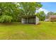 A useful metal outbuilding in the backyard provides storage space and protection from the elements at 285 Roosevelt Dr, Saint Stephen, SC 29479