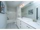 Bright bathroom featuring a double sink vanity, shower-tub combo, and light gray walls at 2962 Clearwater Dr, Mount Pleasant, SC 29466