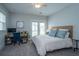 Cozy bedroom with light gray walls, a woven headboard, and access to a small balcony at 2962 Clearwater Dr, Mount Pleasant, SC 29466