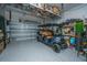 Spacious garage with a golf cart, shelving, and epoxy flooring at 2962 Clearwater Dr, Mount Pleasant, SC 29466